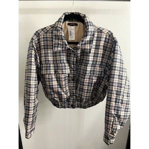 large, plaid jacket, tag on it